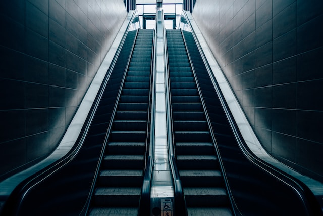 Escalator creating a perception of motion, even when stationary.